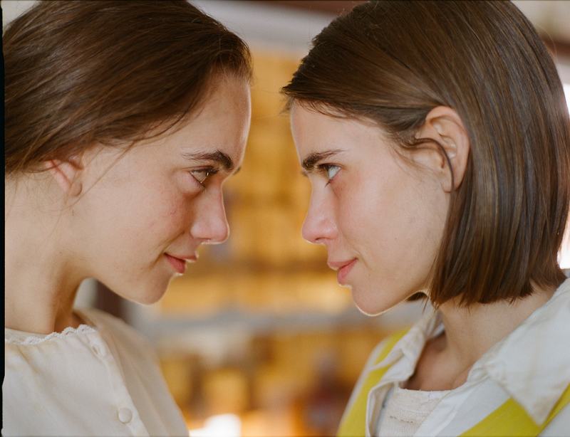 Herra and Bea face each other at close range.